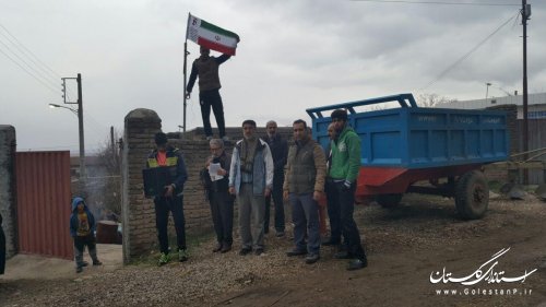 آیین نصب پرچم  در سر درب منازل خانواده  شهدای روستاهای گالیکش