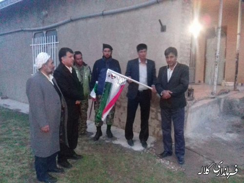 نصب پرچم بر سردرب منزل خانواده محترم شهدادر روستاهای بخش مرکزی