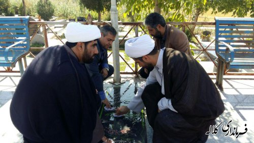 غبارروبی و عطرافشانی گلزار شهدای کلاله بمناسبت هفته نیروی انتظامی