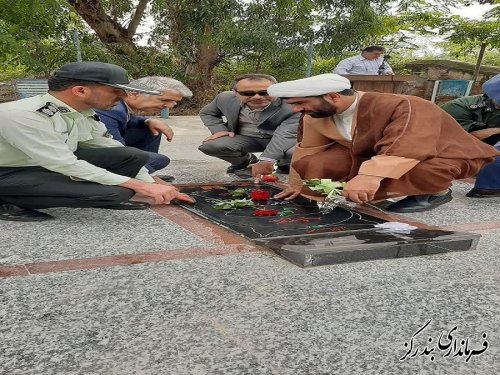 غبارروبی و عطرافشانی مزار شهدا در بندرگز به مناسبت هفته فراجا